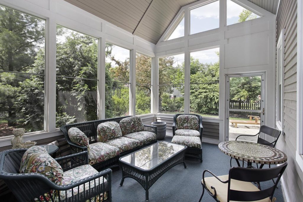 Porch in suburban home with wicker furniture