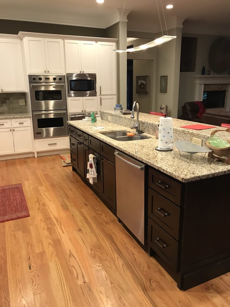 kitchen with granite countertop and 2-tier barstool seating